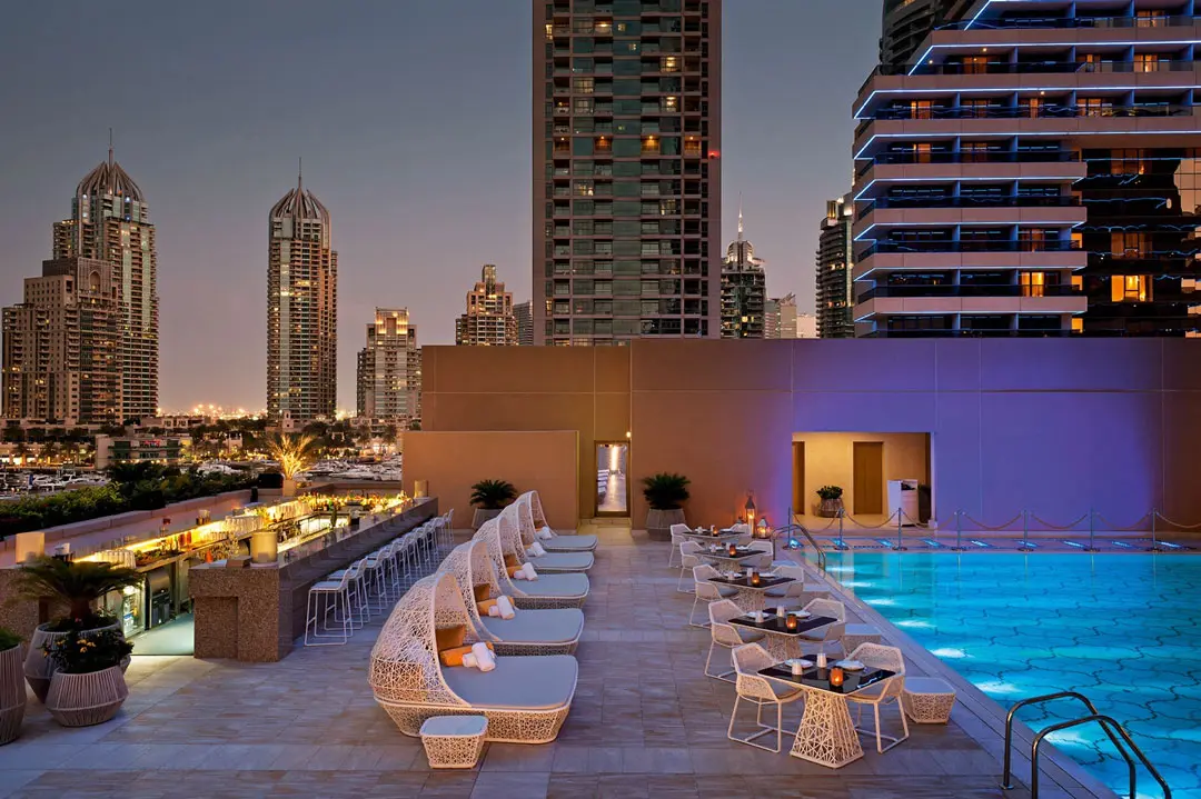 Luxury hotel rooftop pool in Dubai representing hospitality guest WiFi analytics, smart hotel experience and guest engagement solutions