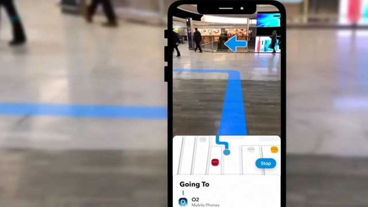 Smartphone showing augmented reality indoor navigation in a shopping mall using BLE beacons and WiFi indoor positioning system